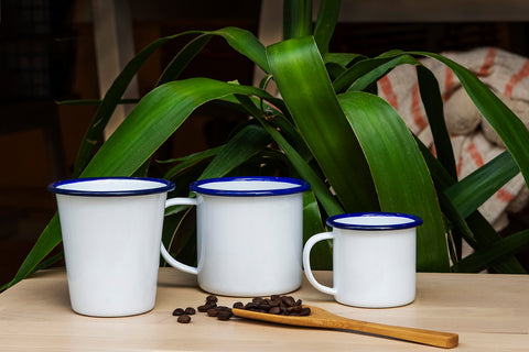 photo shows white enamel beaker, mug and espresso mug, each with blue rim