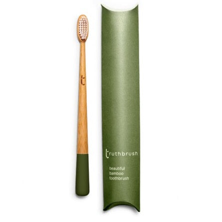 Photo shows a bamboo toothbrush in moss green colour