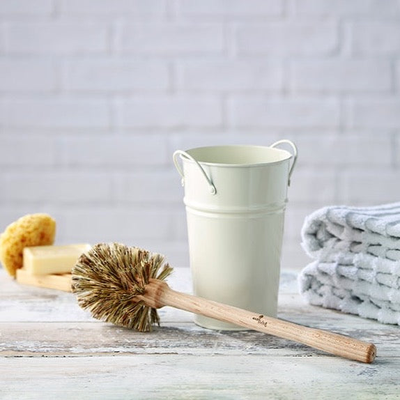 photo shows plastic-free toilet brush and holder, made from natural renewable materials.